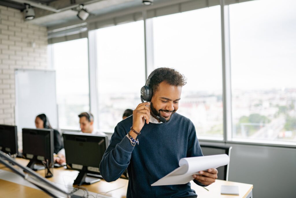 Man using VoIP apps and services in his call center solutions.