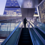 A businesswoman collaborating with an AI assistant on a sleek desktop, symbolizing artificial intelligence transforming customer service.