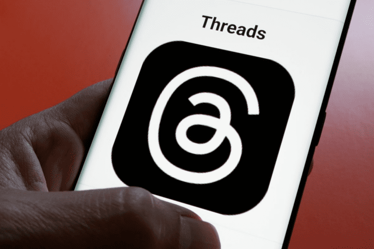 **SEO-Optimized Alt Text:** "A marketer views brand engagement stats on Threads, highlighting insights from Sprout Social on why brands are choosing Threads over X."