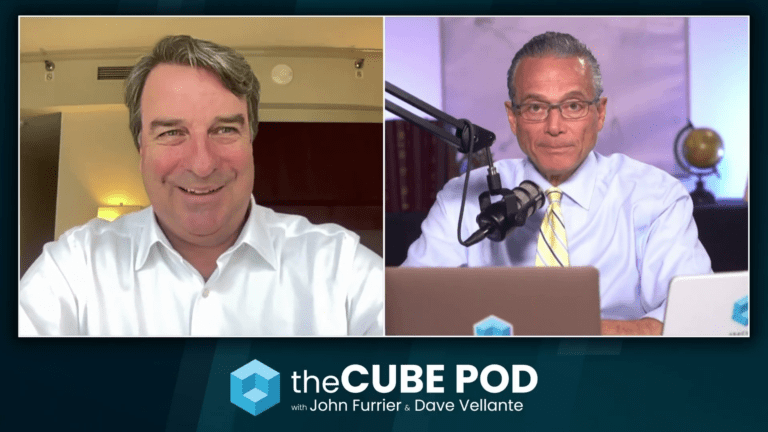 Alt Text: "A professional using code-powered business automation on a laptop, streamlining tasks with AI and cybersecurity safeguards."