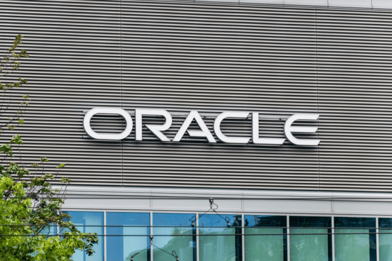 **Alt Text:** "A business professional uses NetSuite AI tools on a laptop, streamlining data entry, pricing, and billing for efficient operations."