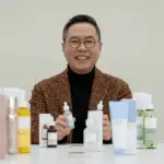 Alt Text: "A smartphone screen shows a customer support chat, highlighting cybersecurity risks as social media and K-dramas expand MA:NYO's audience reach."